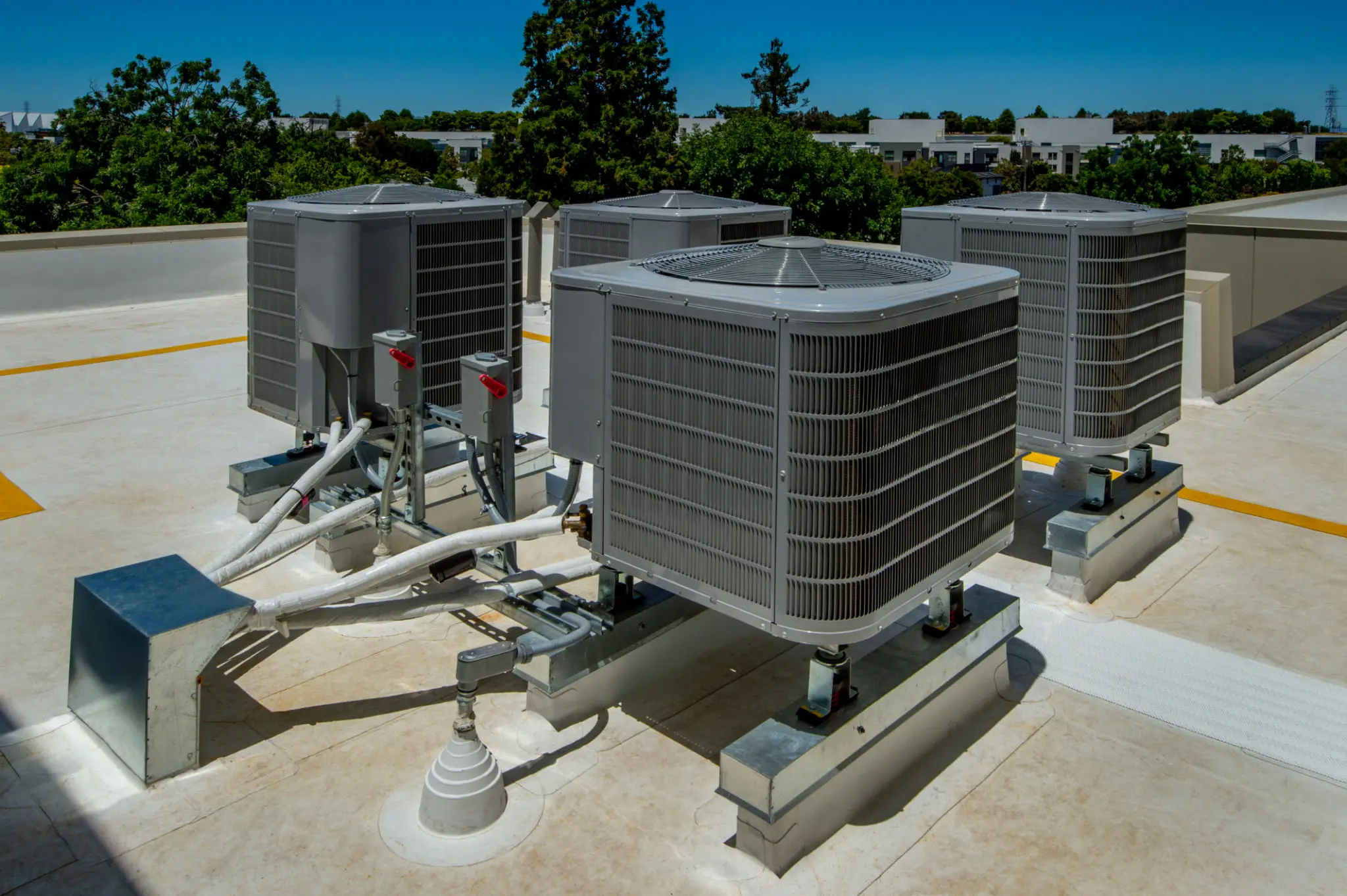 Rooftop commercial air conditioning units with piping