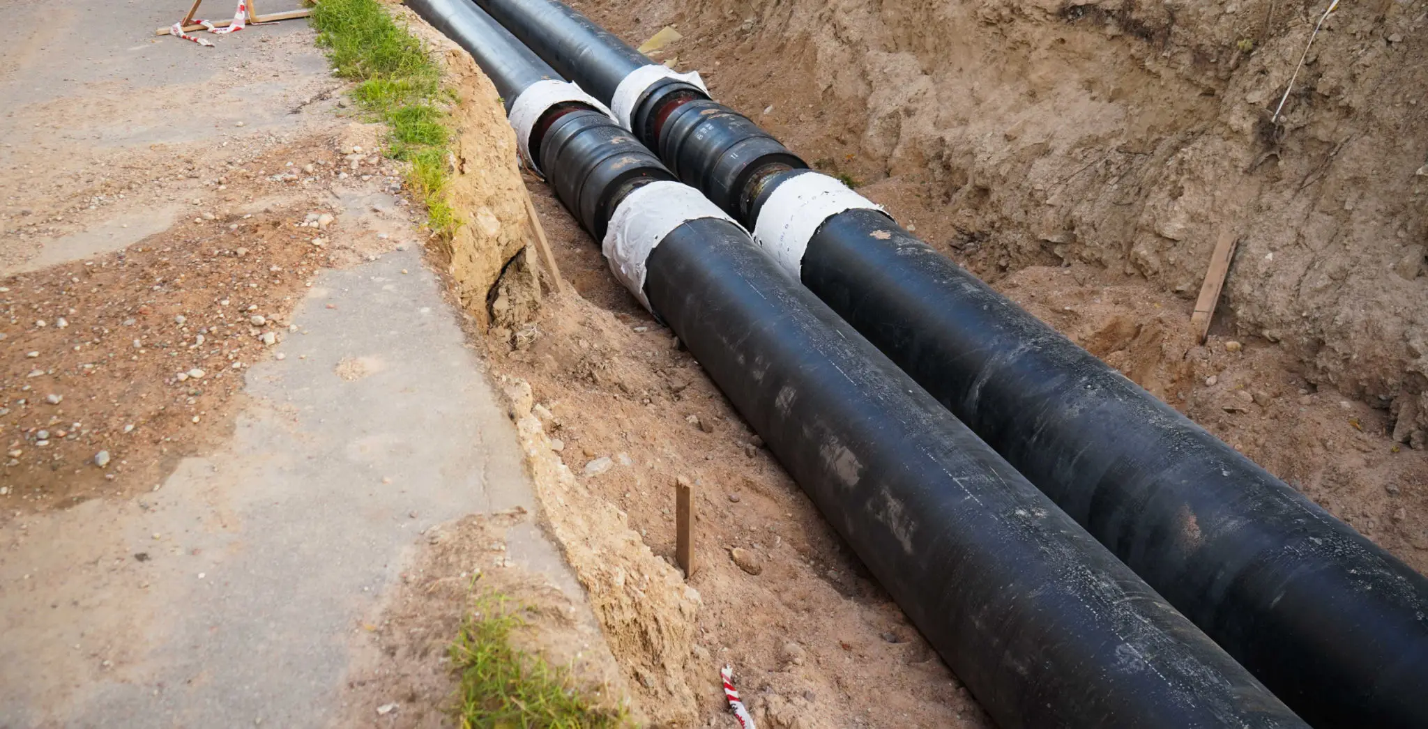 Two large underground pipes laid in trench